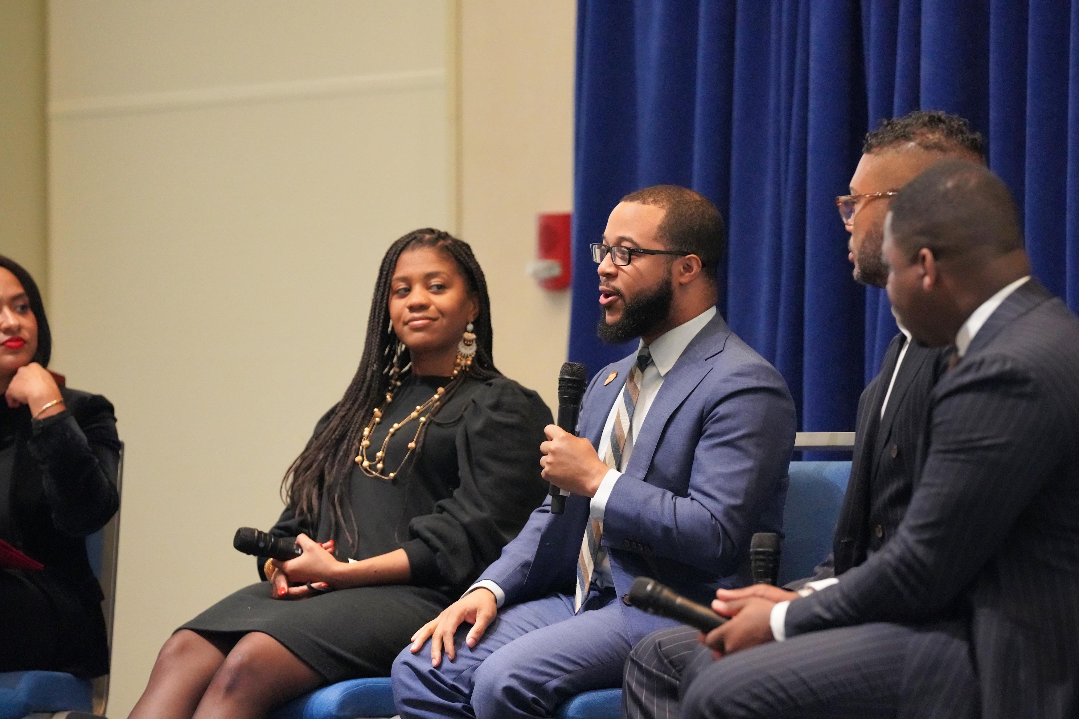 Segun Idowu speaks during a BLM Day panel.  