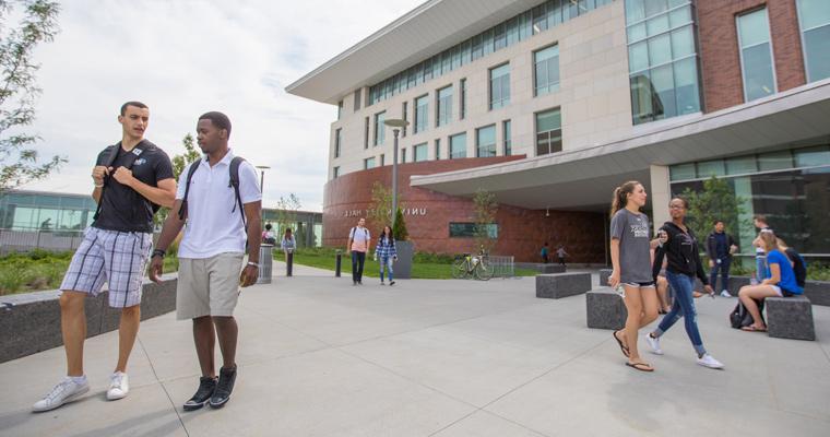 Students walk outside University Hall 